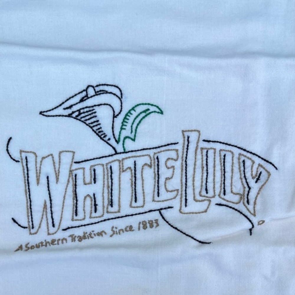 New! 25 year old White Lily Embroidered Dishtowel from Guenther House in Texas.